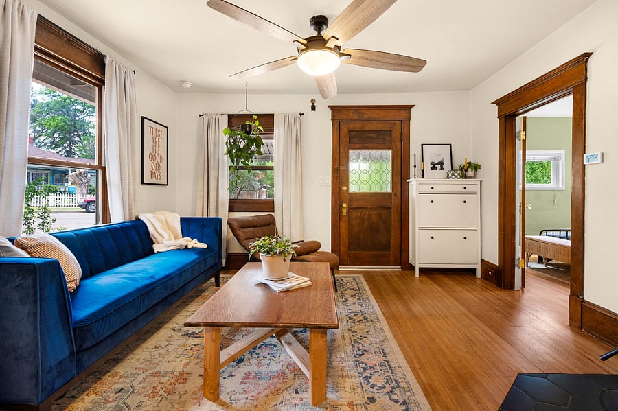 Living room: sofa, leather chair, coffee table and shoe storage.