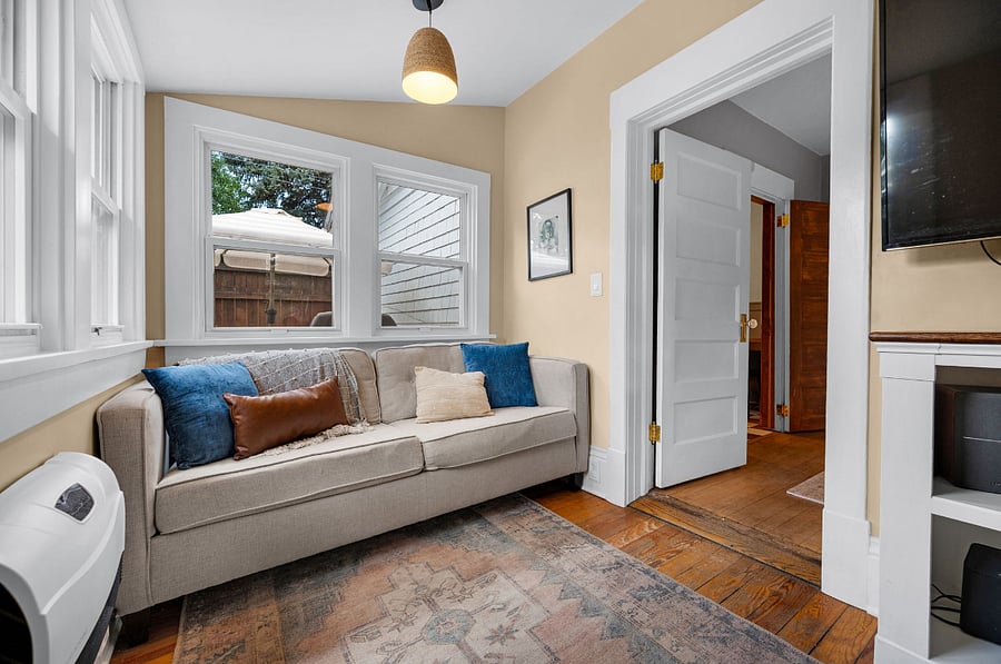 Pull out sofa can be used for hosting extra guests. This is also our TV room. *Playstation and record player not included in rental.