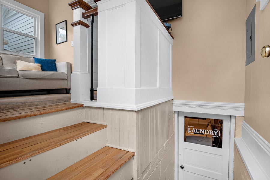 Laundry is located downstairs. This small staircase also leads to the backyard.