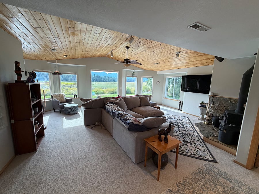 another view of the living room, with smart TV and wood burning stove