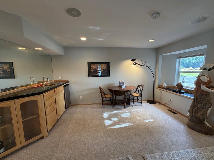 downstairs bonus area with wet bar, table, games and puzzles