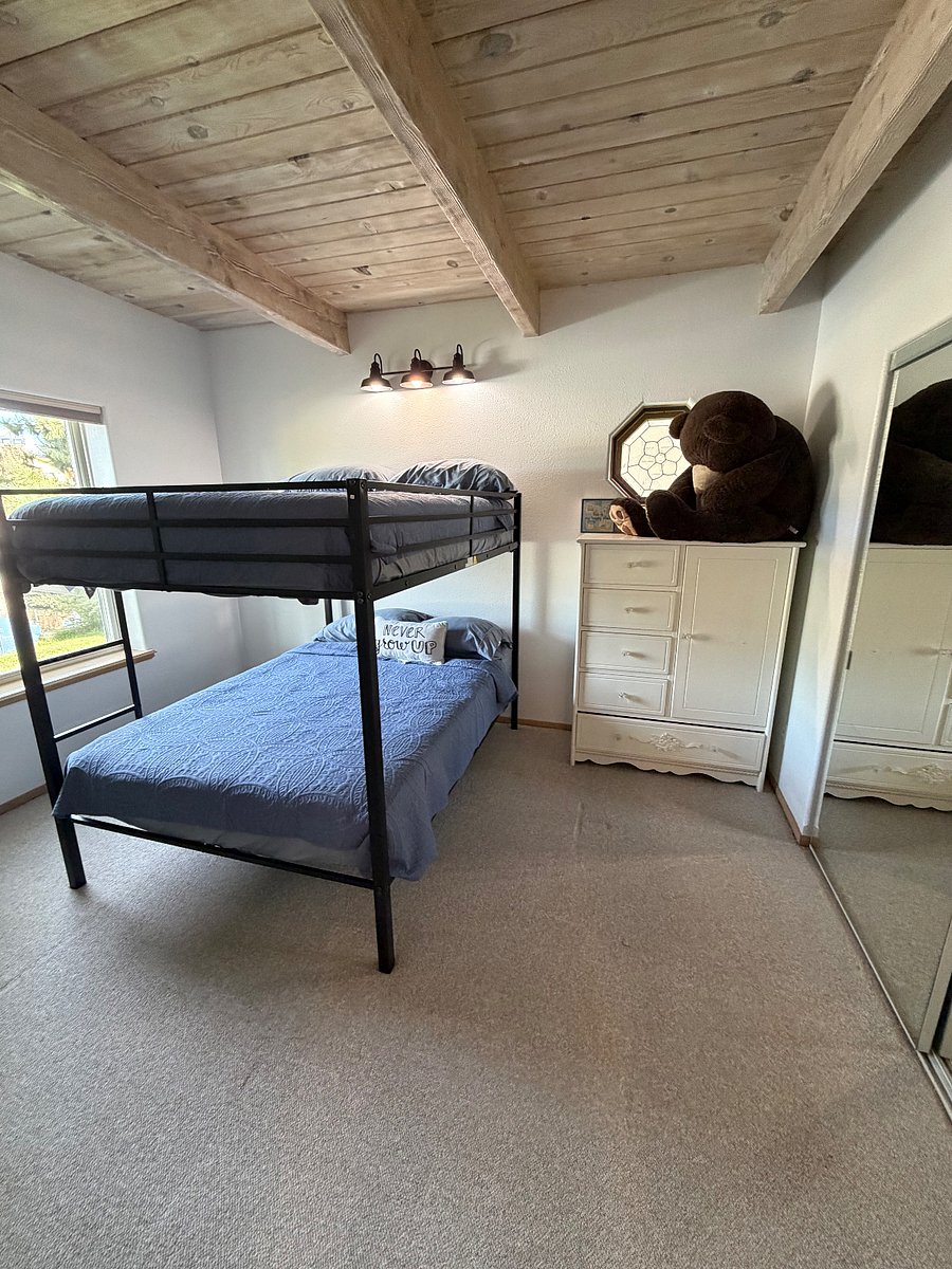 3rd bedroom with full size bunk beds, dresser, large closet.