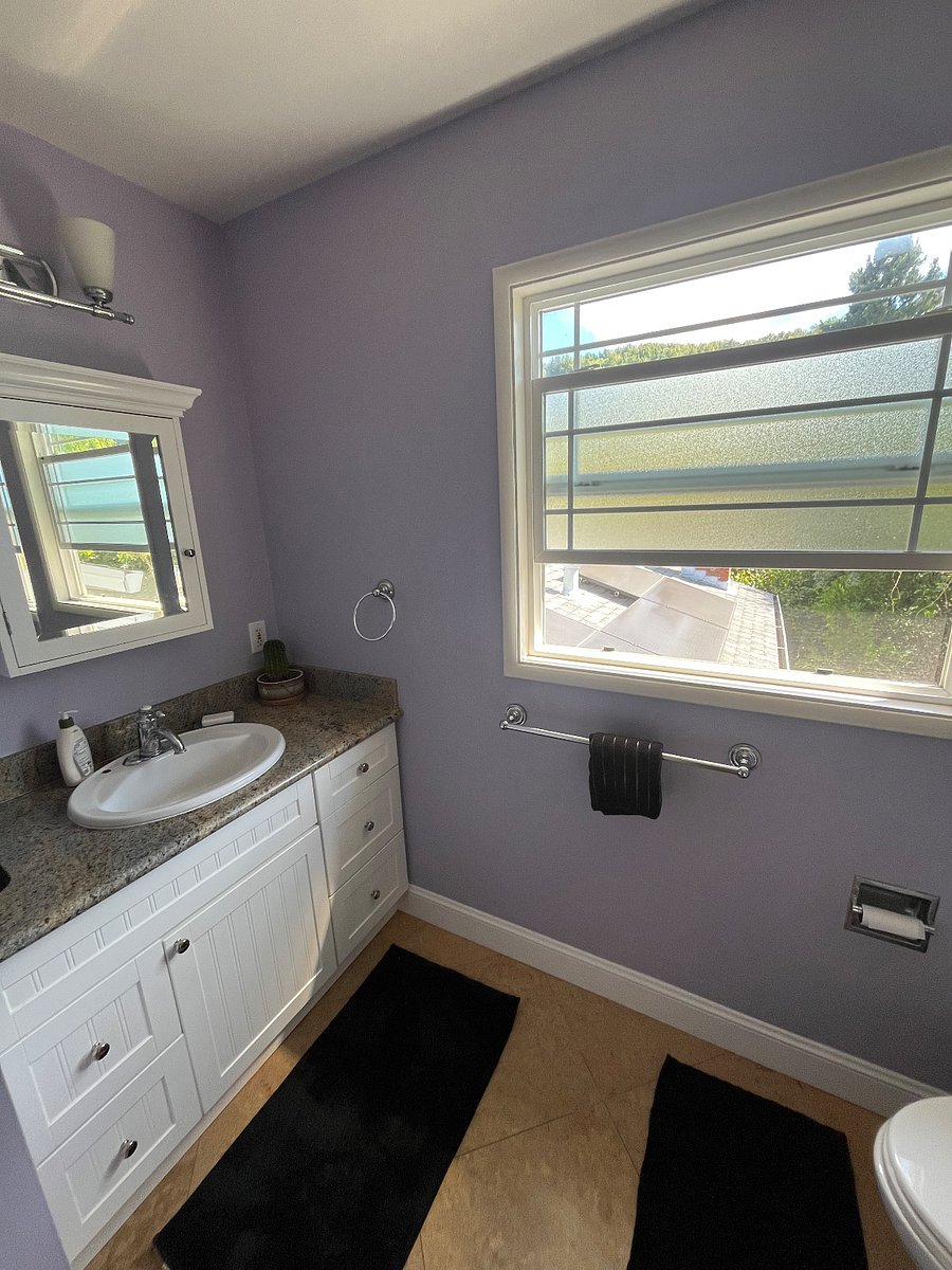 Private bathroom with a view to shared backyard