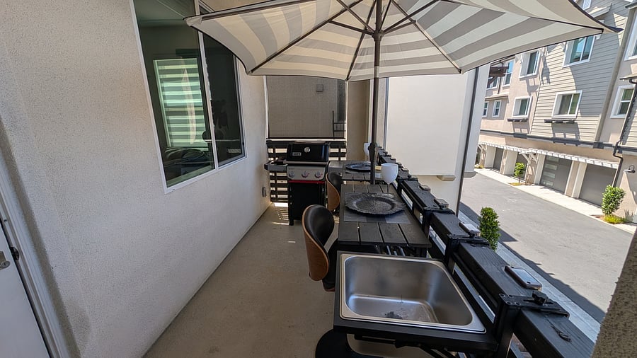 2nd story balcony with Weber grill and seating