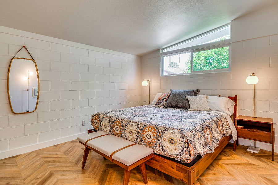 View 1: Guest bedroom 1 with tv and MCM clerestory window.
