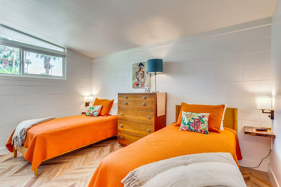 View 1: Guest bedroom 2 with 2 twin beds, tv and MCM clerestory window