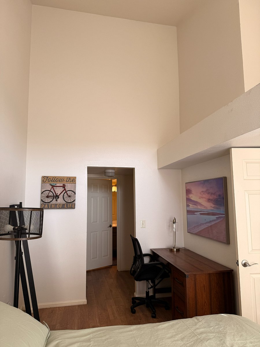 Downstairs bedroom walking into closet and attached full bath.