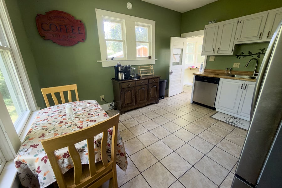 The kitchen breakfast nook seats three with windows on two sides. Morning coffee with the birds and squirrels will help your day start right. Dedicated coffee bar, fully equipped kitchen, and a mudroom right around the corner for when you come off the trail.