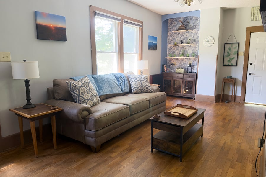 Original hardwood floors, local artwork throughout, and a copper fish above the shelves handcrafted by a Brevard native. Designed to help you unwind after a hard day whether you were pounding keyboards or pounding trails.