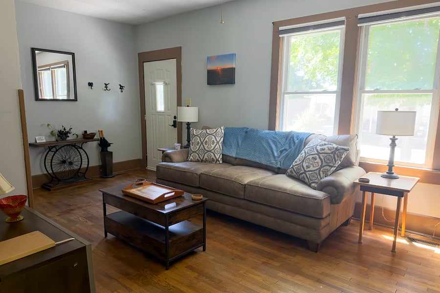 The afternoon light through those original windows is something else the living room earns its keep from morning coffee to evening wind-down.