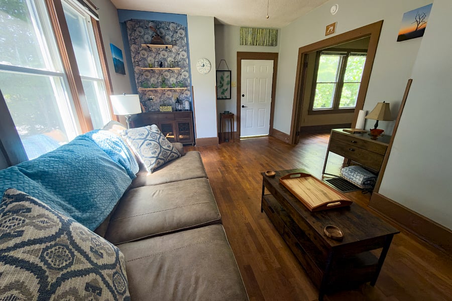 Hardwood floors throughout, oversized windows, and natural light throughout--the living room flows directly to your private covered porch.