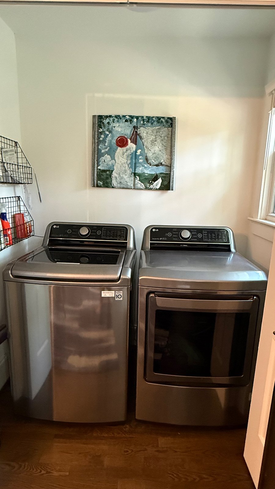 LG Smart washer and dryer.
Tucked away behind double doors off of dining.