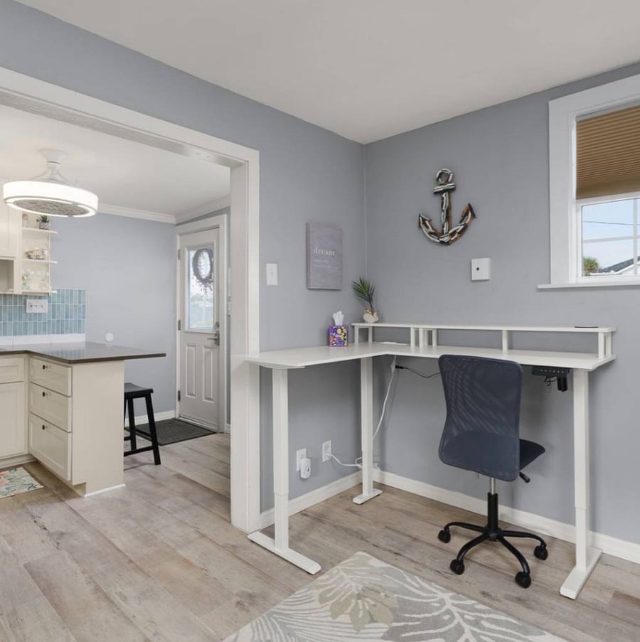 Living room with work station.  Adjustable electric desk