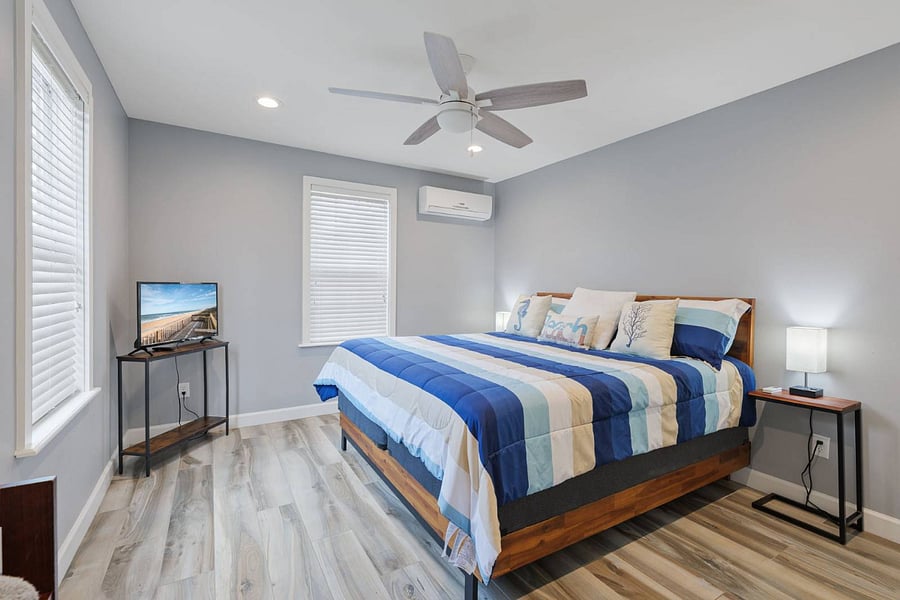 Master Bedroom with King size bed.  Walk in closet is in there too with hanging clothing space, drawers and shelves.