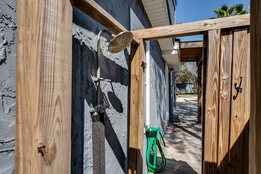 Outdoor showers are always great for sandy toes!  There is a hose outside too for washing down chairs and beach items.