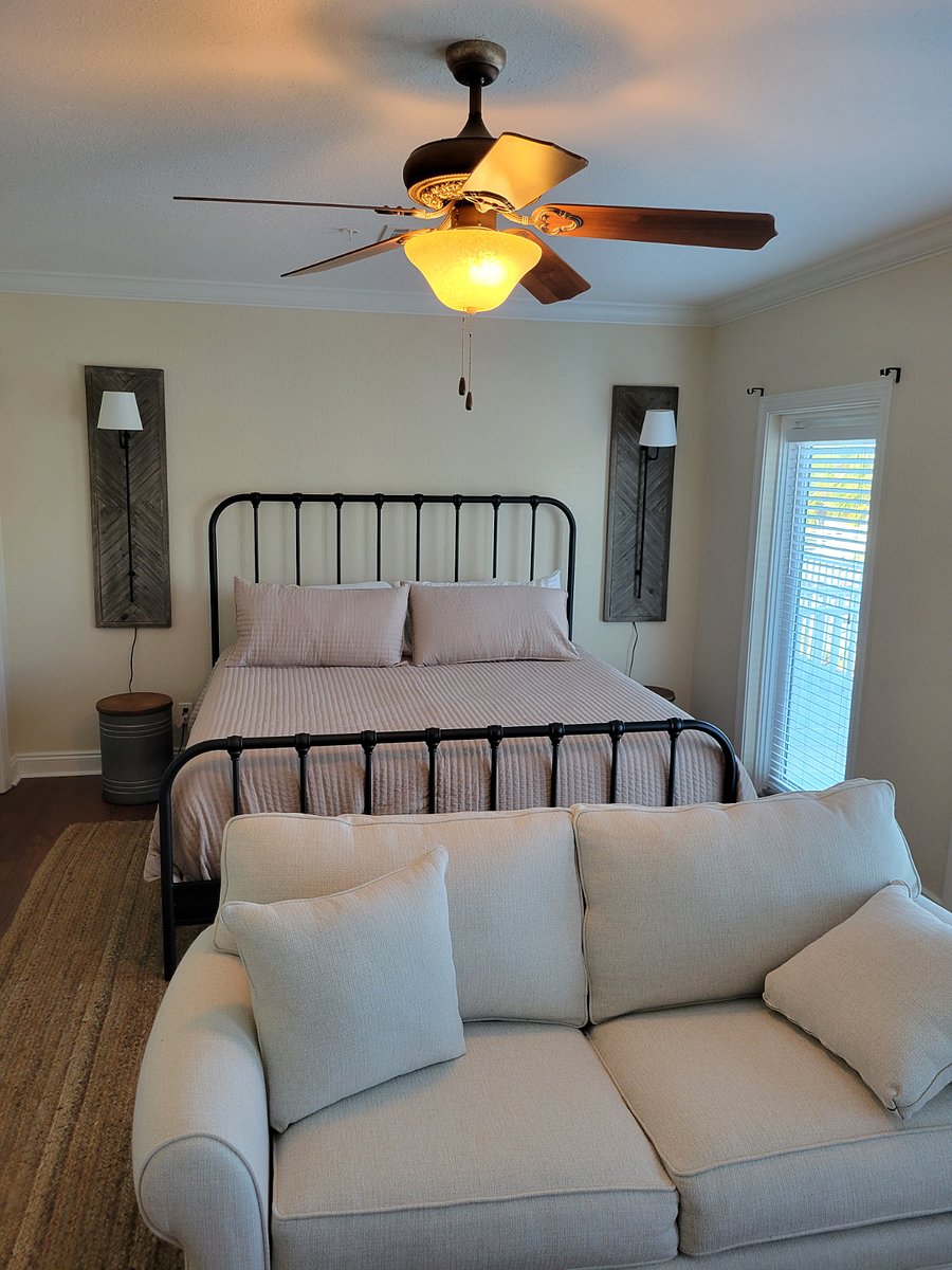 Primary Bedroom Bed and Sofa