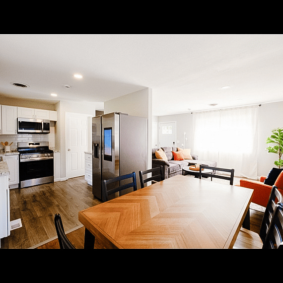 Great size dining table open to kitchen and living room. 