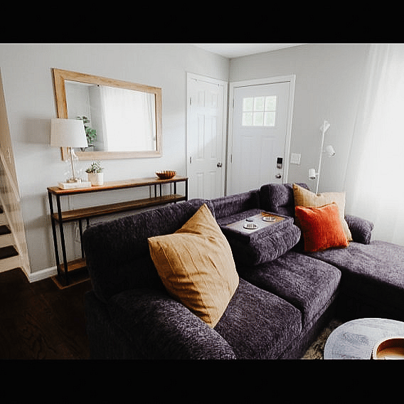 Nice entry with closet to the right for coats and shoes! The comfy couch has a built in ottoman that creates a great lounging space!