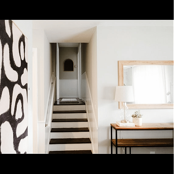 A few stairs up to the bedrooms and office creates separation from the living room. Also makes the rooms high off the ground for pretty views of the trees in the neighborhood!