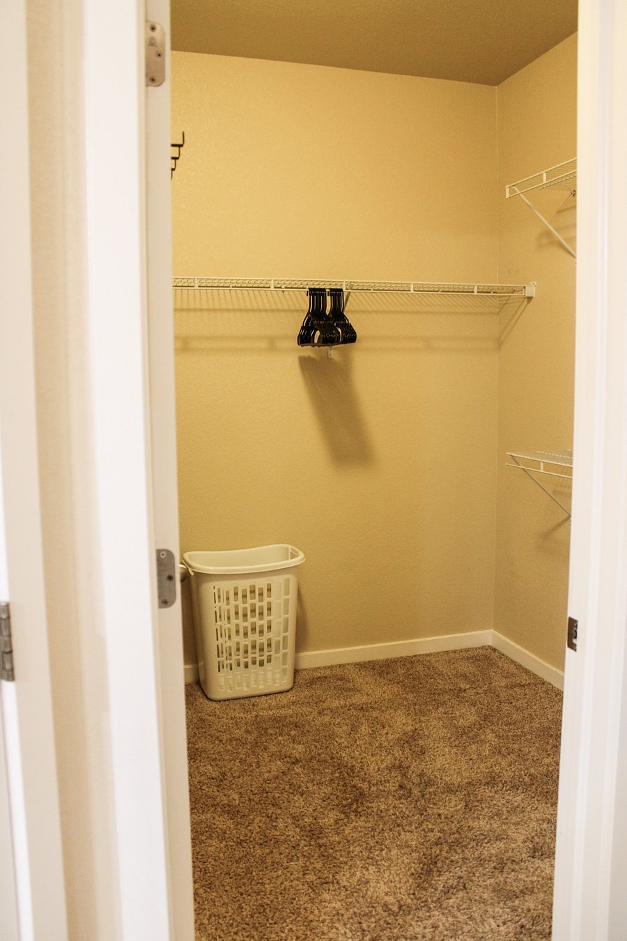 Master Walk-in Closet, shoe rack, laundry basket, and hangers