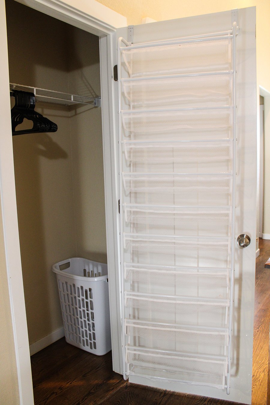 Bedroom #2-Closet, shoe rack, laundry basket, and hangers