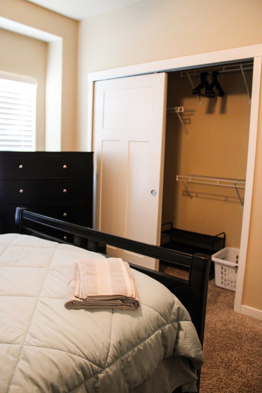 Bedroom # 3-Closet, shoe rack, laundry basket, and hangers