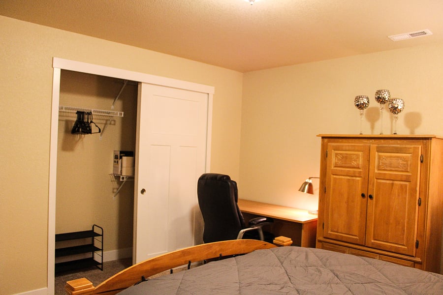 Bedroom #5-Closet, shoe rack, laundry basket, and hangers