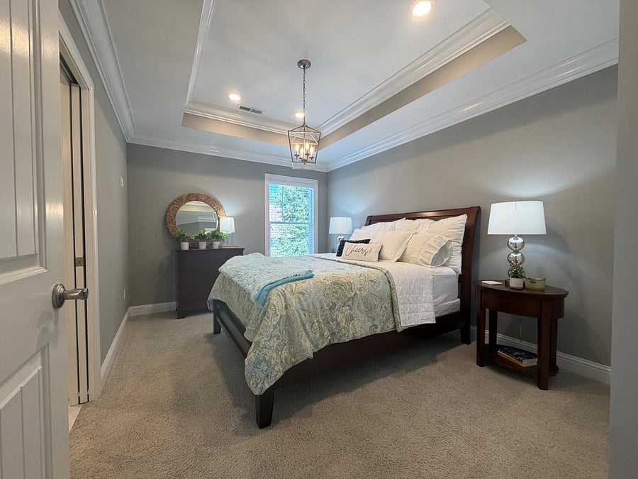 Private bedroom with queen bed, dresser, closet and private en-suite bathroom.