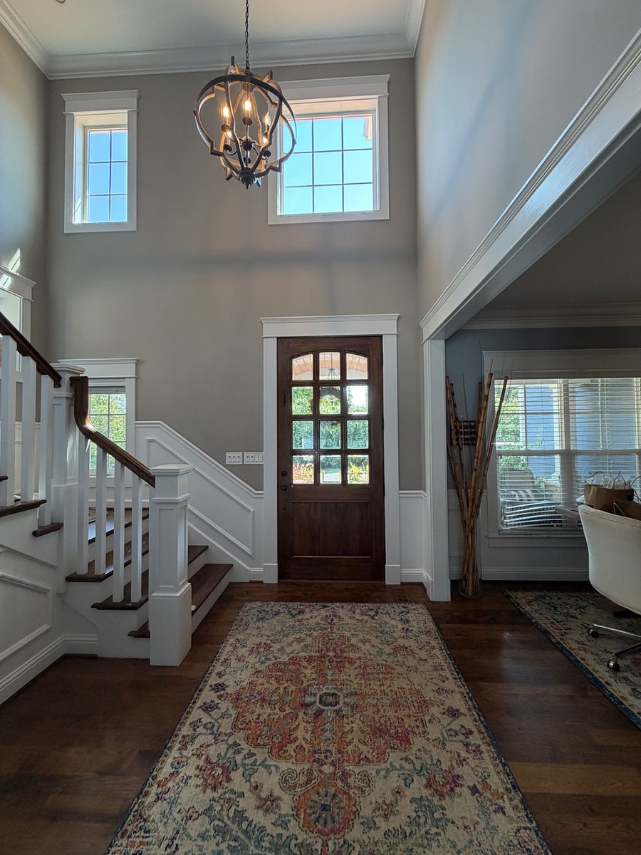 Front entry with u-shaped stairs to bedrooms and laundry.