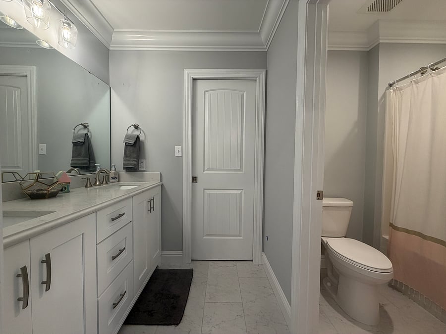 Private bath with double sink.