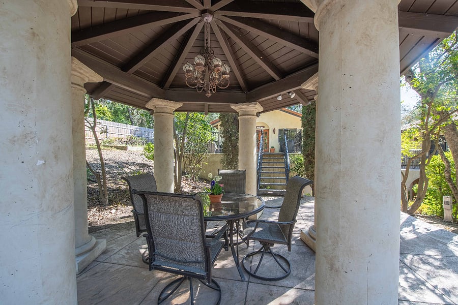 Gazebo with dining table and chairs