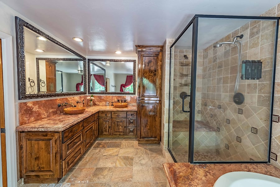 Primary BR en suite with dual vanities, walk-in shower and jetted tub.