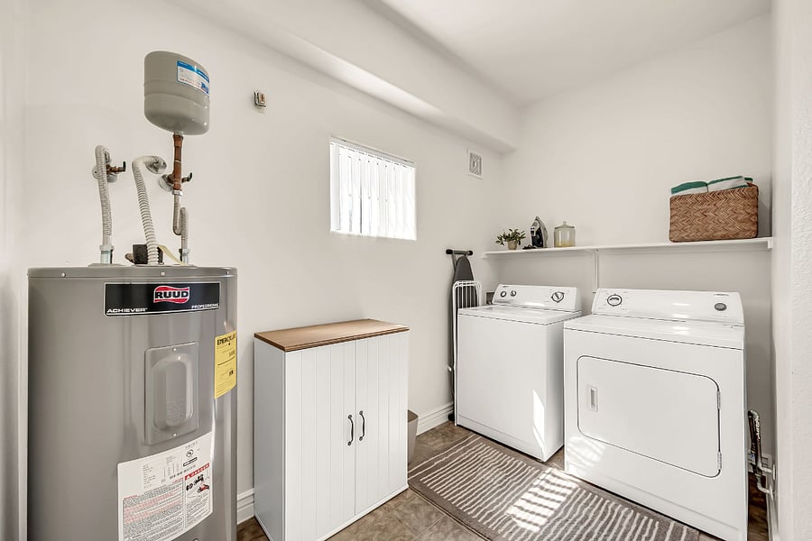 Full-size washer and dryer in unit.