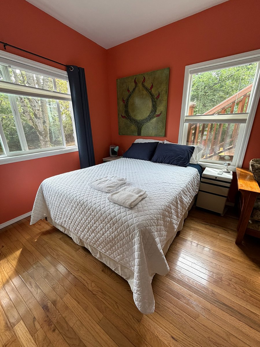 Main bedroom with queen bed and abundant natural light
