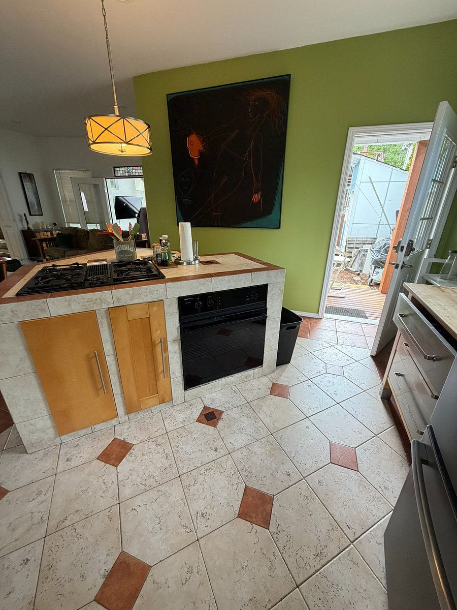 Gas range, oven, and generous kitchen workspace