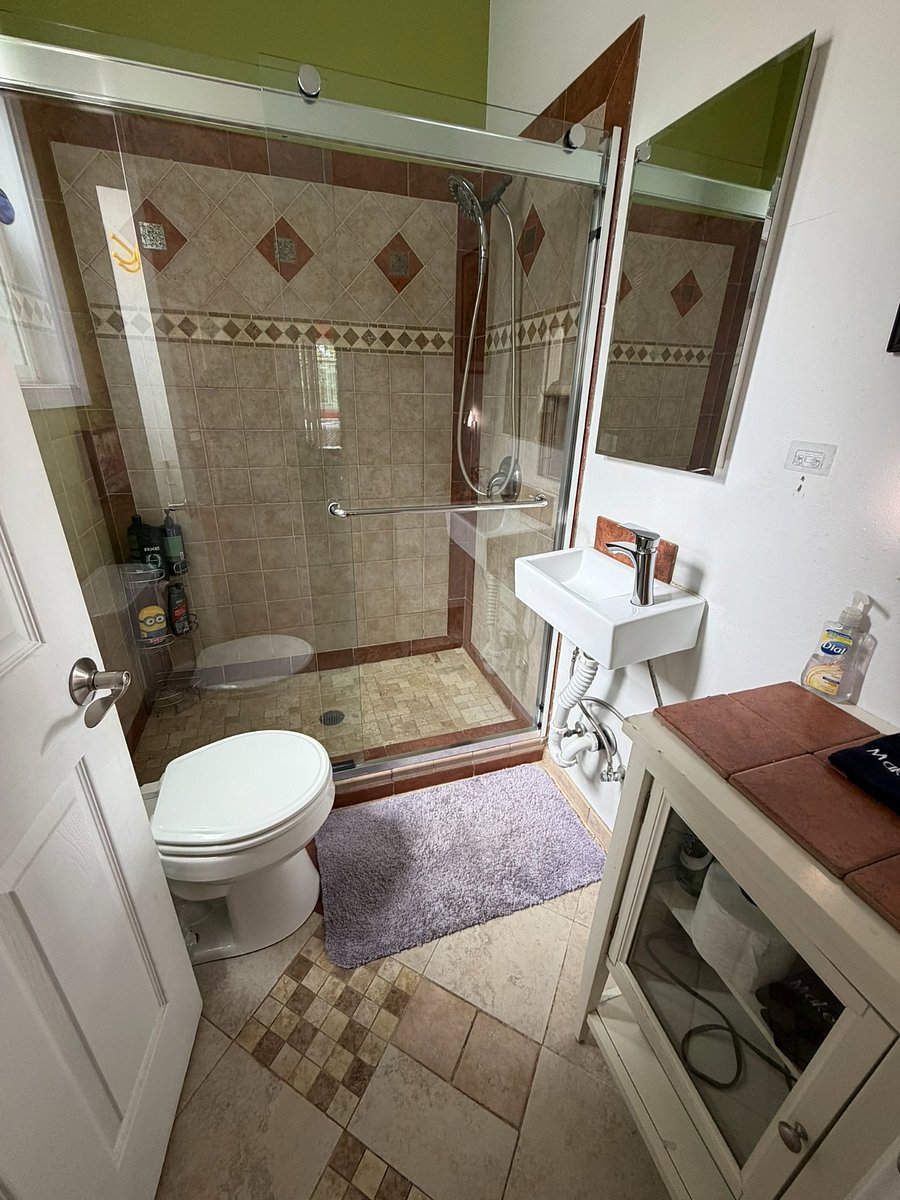 Full bathroom with walk-in shower and no bathtub