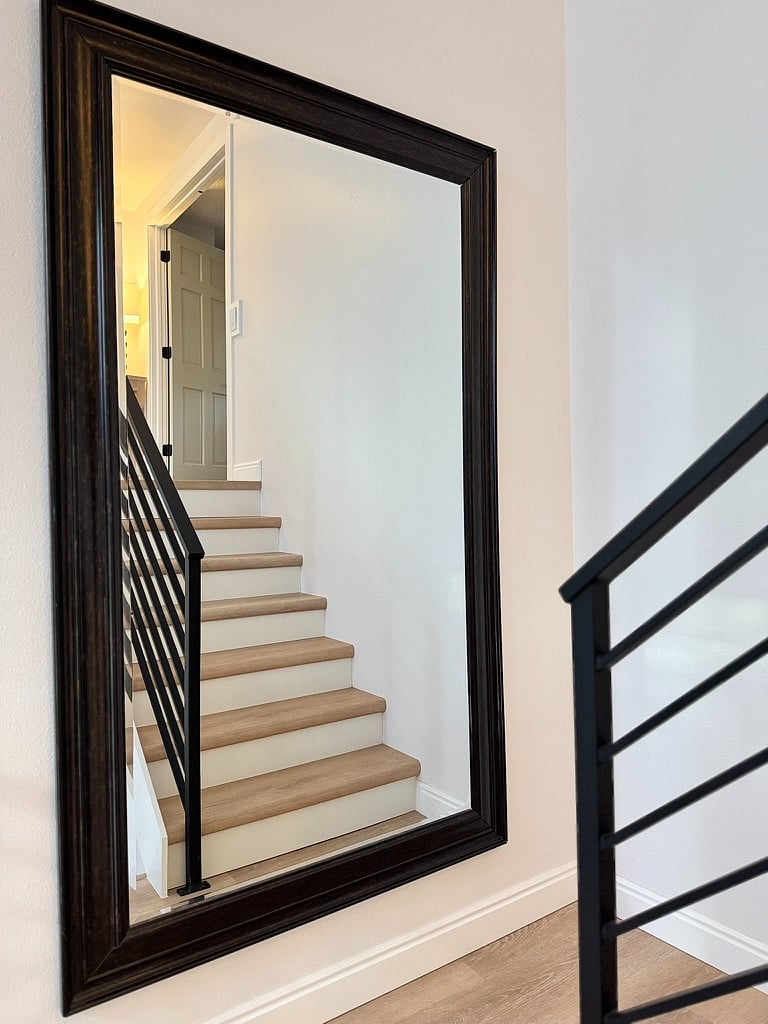 Newly renovated staircase with large oversized mirror