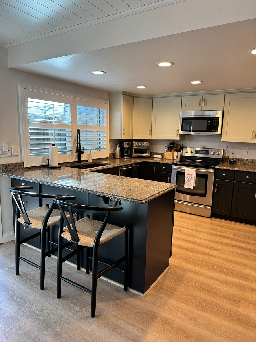 Additional dining seating with two barstools at kitchen counter