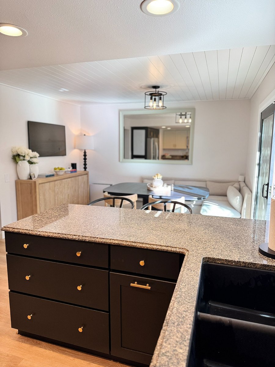 Crate & Barrel banquette and dining set. The Frame TV by Samsung. Additional counter seating with barstools
