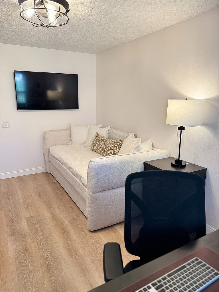 Twin daybed with twin pullout trundle bed in upstairs office and smart TV