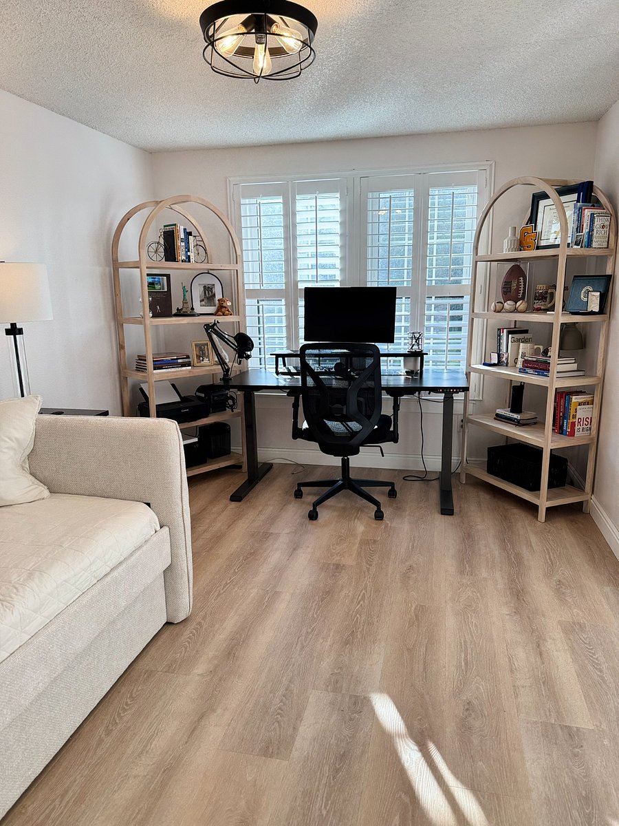Twin daybed with pull-out twin trundle bed in upstairs office with sit-stand desk and ergonomic chair