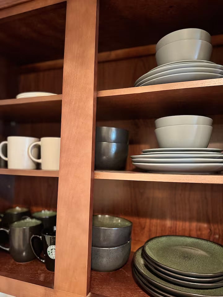 Variety of dishware in basement kitchenette