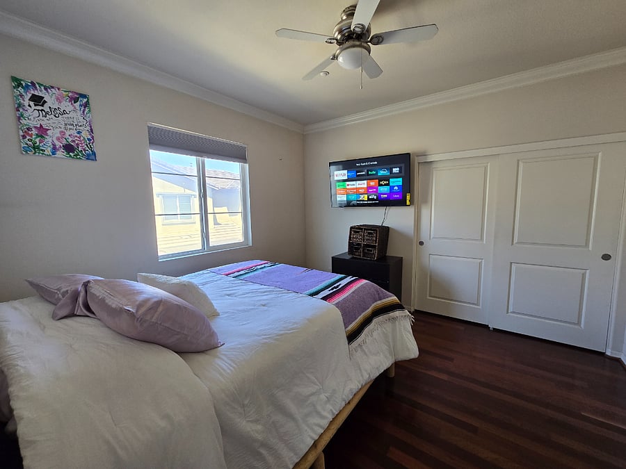 Master bedroom with TV and 2 closets
