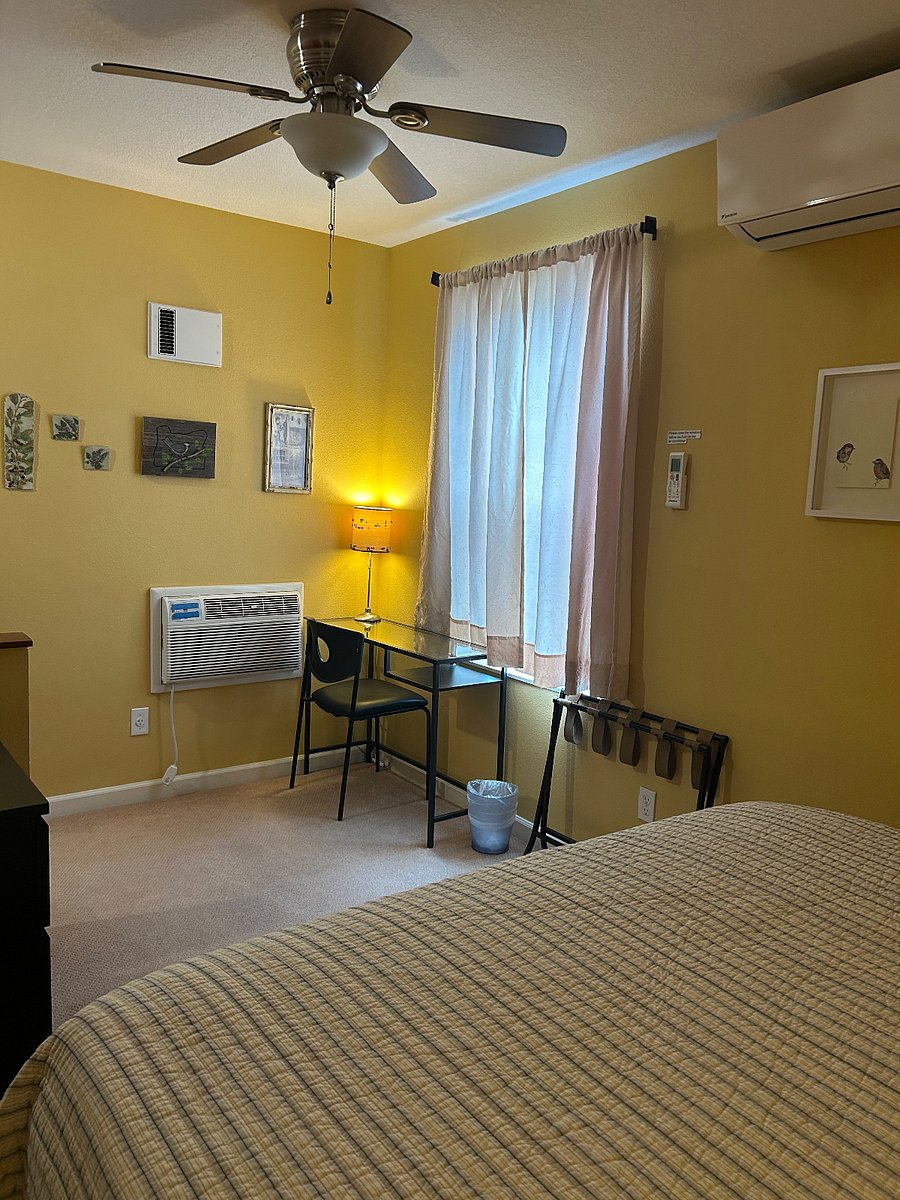 Bedroom with desk and dresser, and walk-in closet