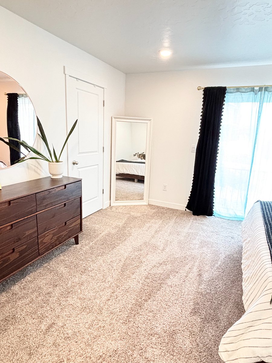 Master bedroom includes dresser and walk-in closet