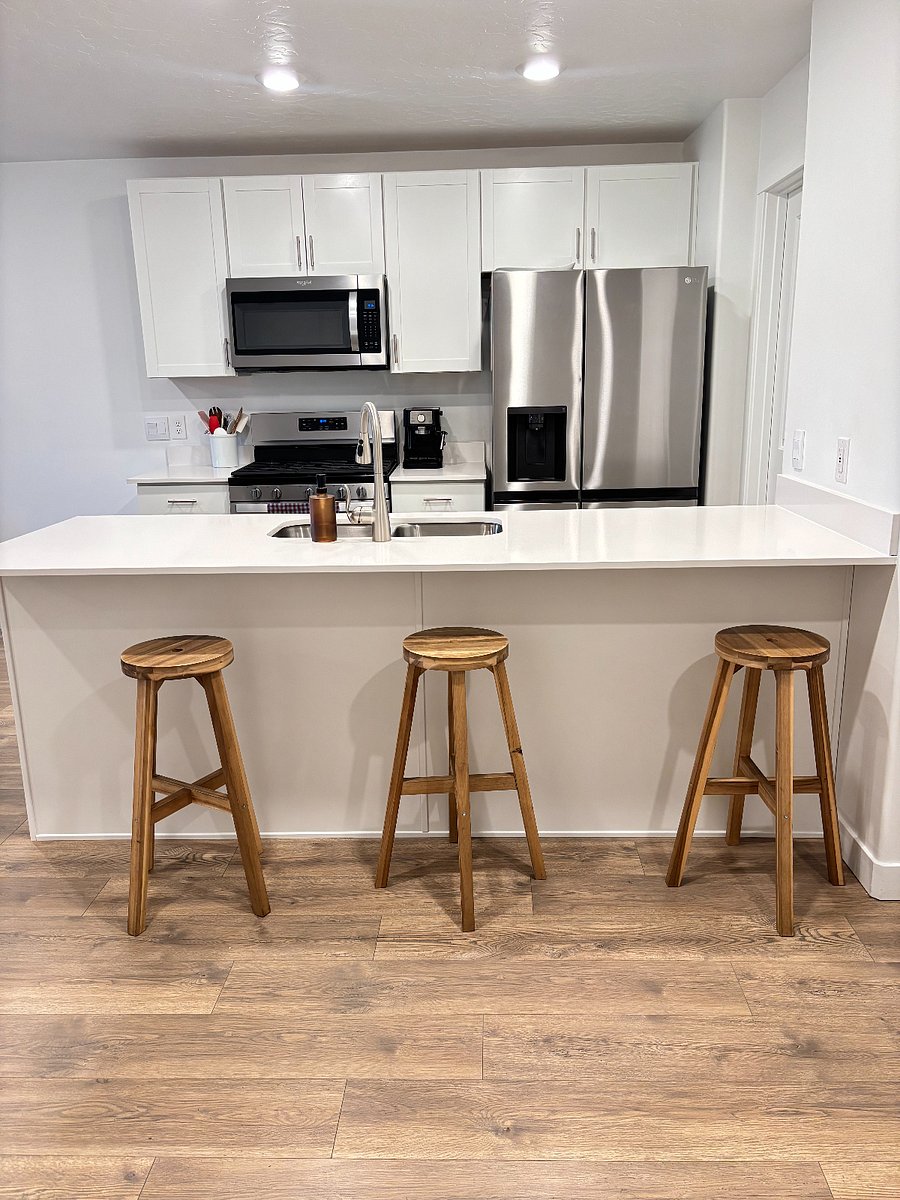 Kitchen area with bar stools