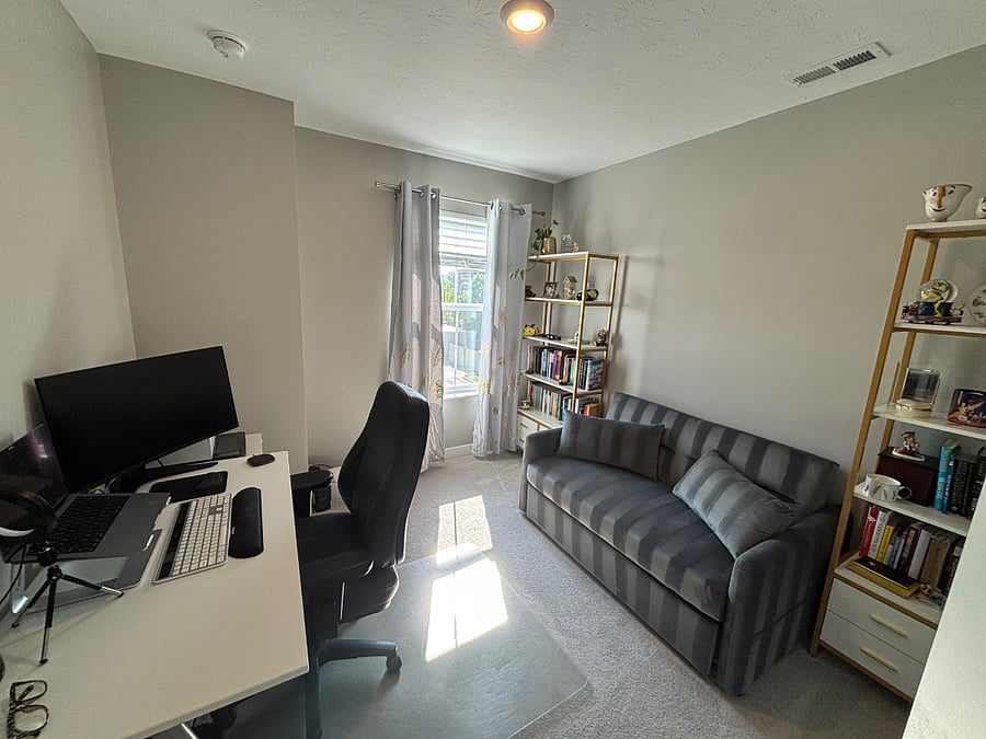 Shared office with full size pullout bed for occasional guests. 