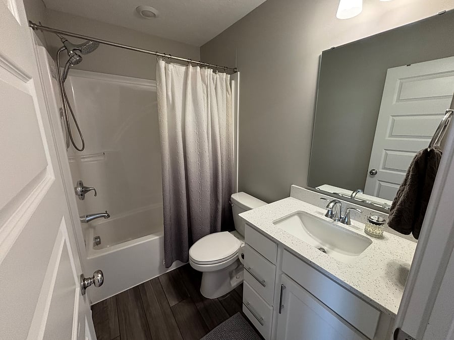 Private bathroom with Moen double shower head and handheld