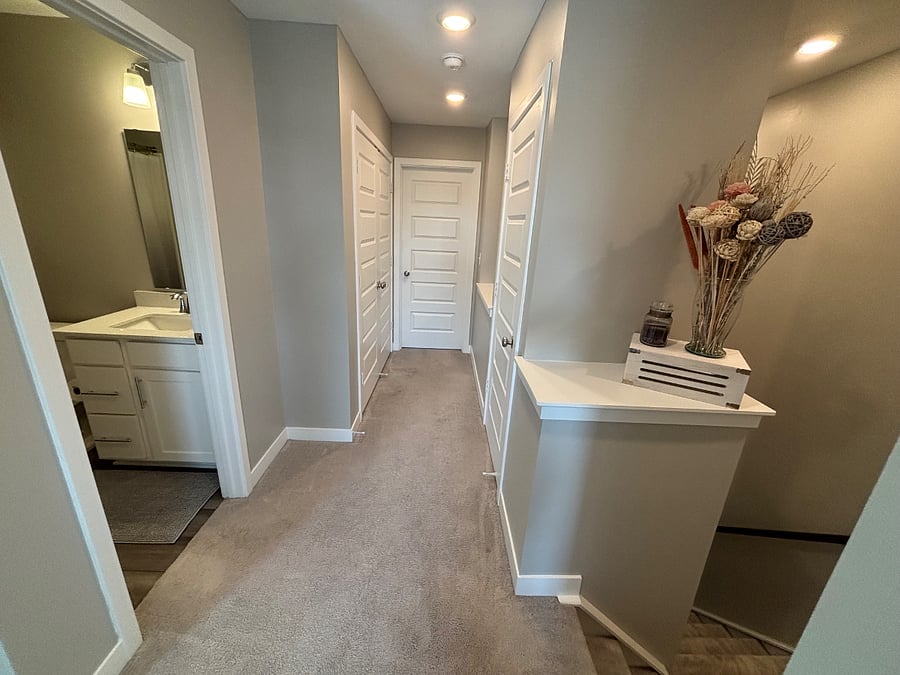 Hallway outside of bedroom and office leading to the bathroom and laundry. 