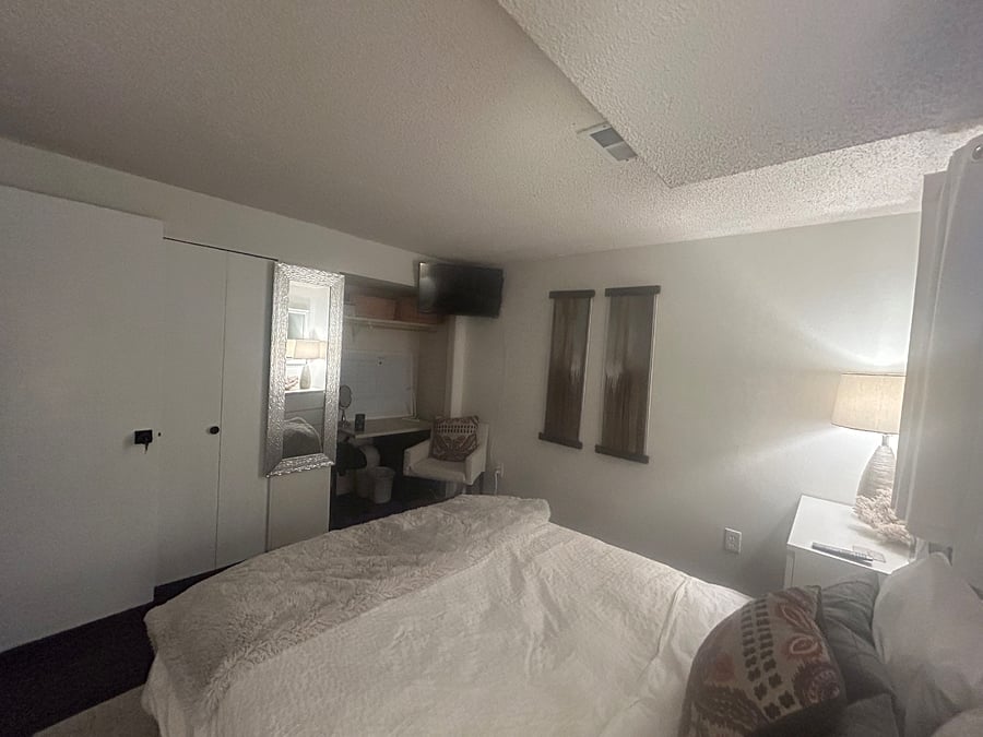 Wall mounted tv, desk and closet
